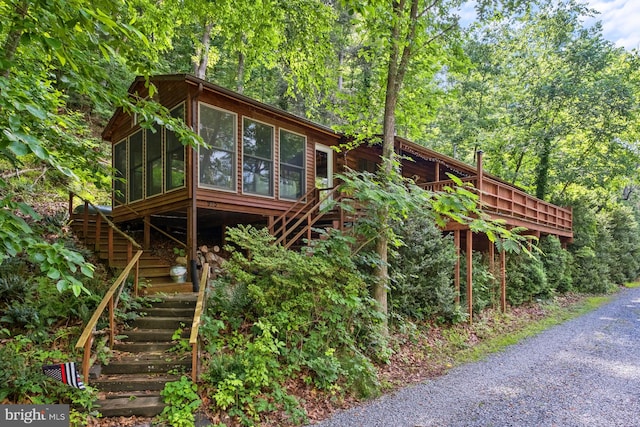 view of side of property with a sunroom