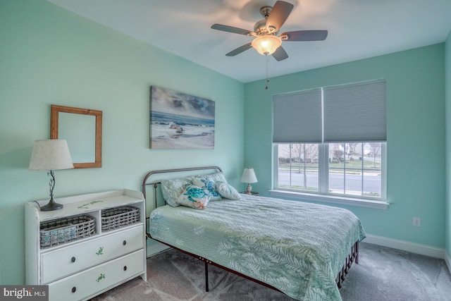 bedroom with ceiling fan and light carpet