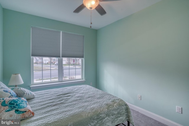 bedroom featuring ceiling fan and carpet floors