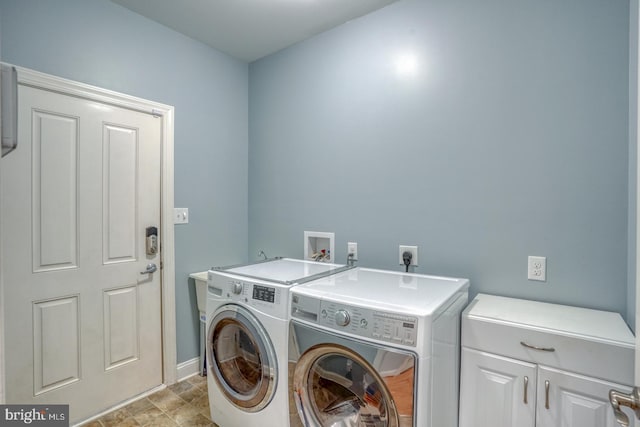 laundry area with cabinets and washer and dryer