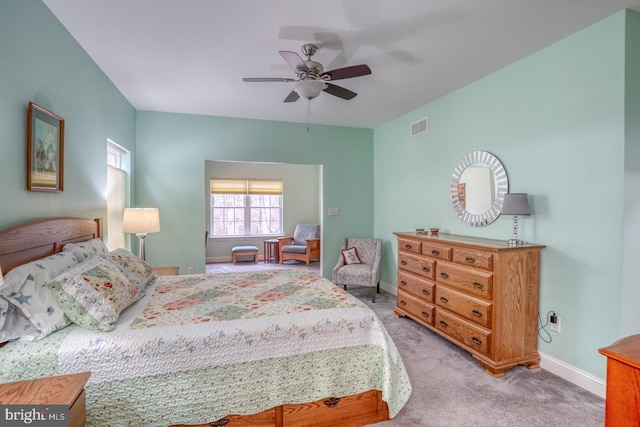 bedroom featuring ceiling fan and light carpet