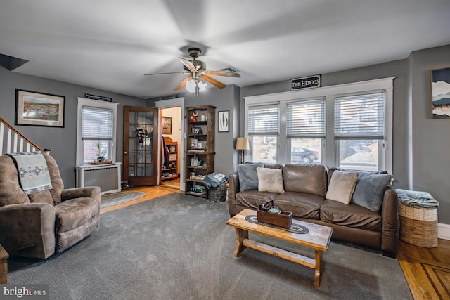 living room with radiator, hardwood / wood-style floors, and ceiling fan