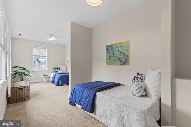 bedroom with carpet floors and baseboards