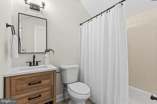 bathroom with toilet, baseboards, and vanity