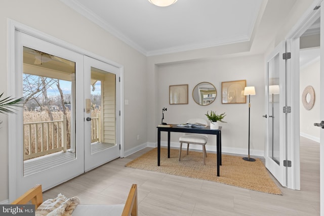 interior space featuring baseboards, crown molding, and french doors