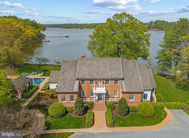 birds eye view of property featuring a water view