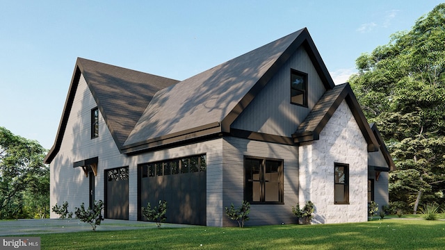 view of front of house with a front lawn and a garage