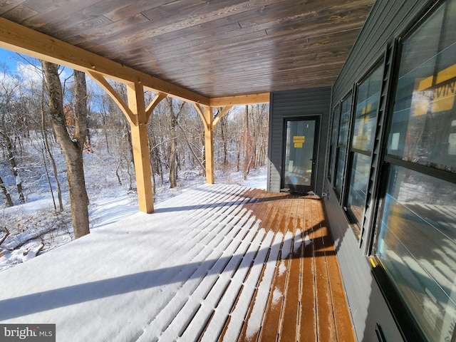 view of snow covered deck