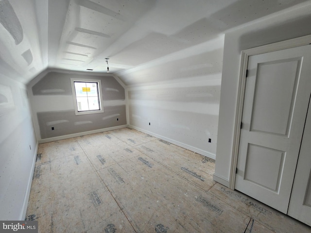 additional living space with vaulted ceiling