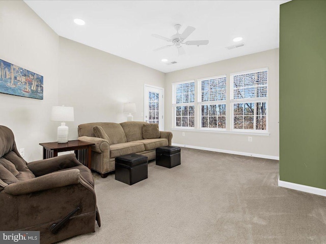 living room with carpet and ceiling fan