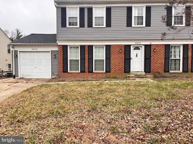 front of property featuring a garage and a front lawn