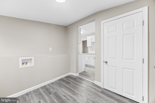 washroom featuring washer hookup and light wood-type flooring