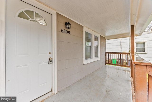 doorway to property featuring a porch