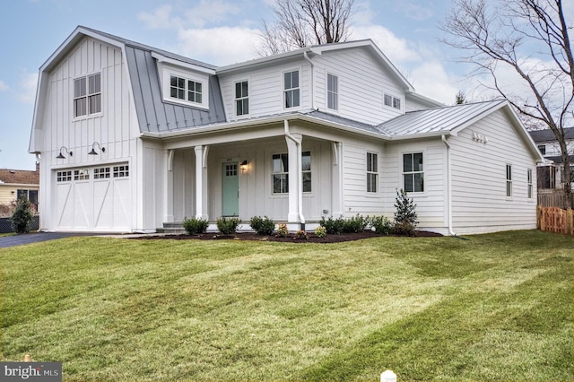 view of front of home with a porch, a garage, and a front lawn