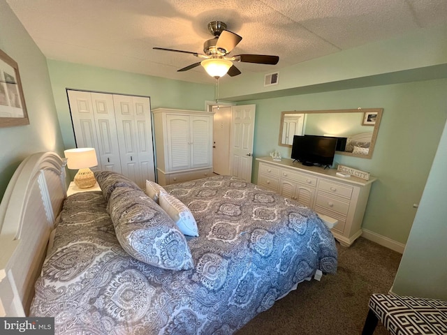 carpeted bedroom with a closet and ceiling fan