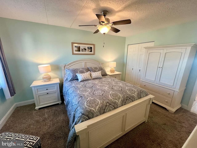 carpeted bedroom with ceiling fan, a textured ceiling, and a closet