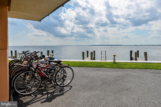 exterior space featuring a boat dock and a water view