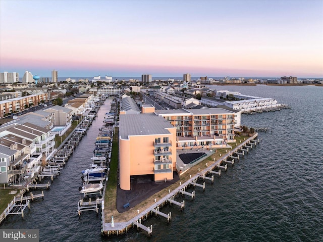 aerial view at dusk with a water view