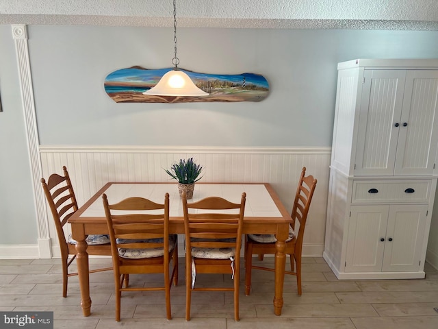 dining space with light hardwood / wood-style flooring