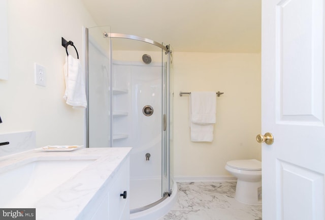 bathroom with vanity, toilet, and walk in shower