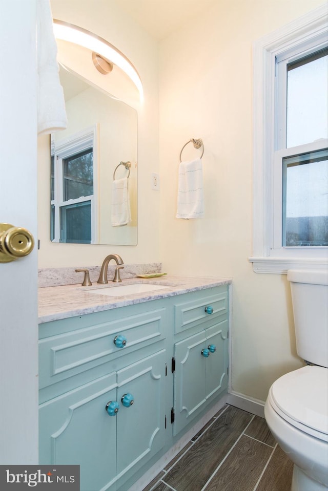 bathroom with vanity and toilet