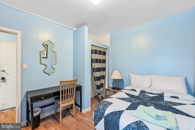 bedroom featuring hardwood / wood-style floors