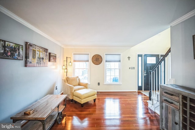 sitting room featuring ornamental molding and dark wood-type flooring