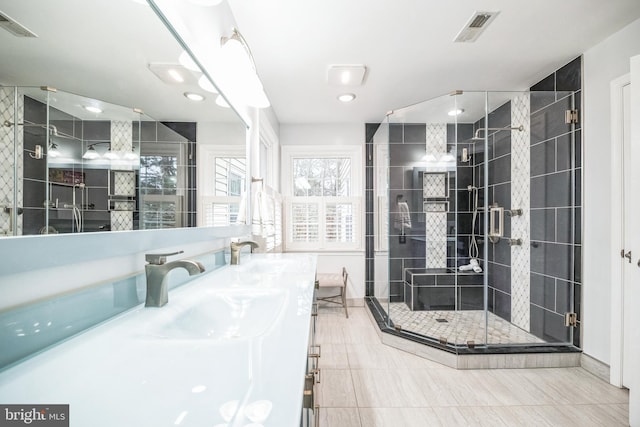 bathroom with an enclosed shower and vanity