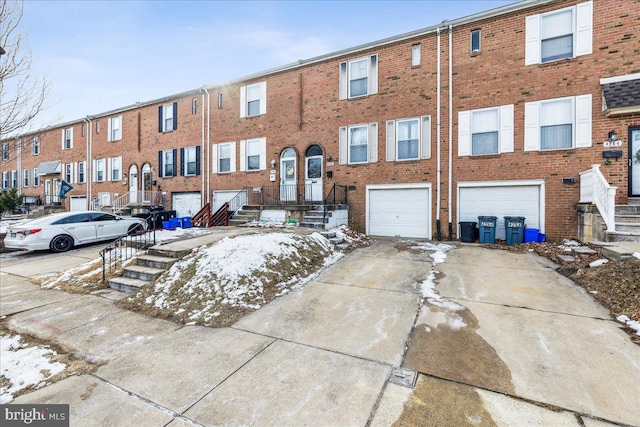 townhome / multi-family property featuring a garage