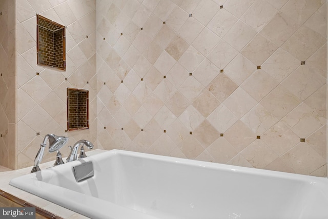 bathroom featuring tiled bath