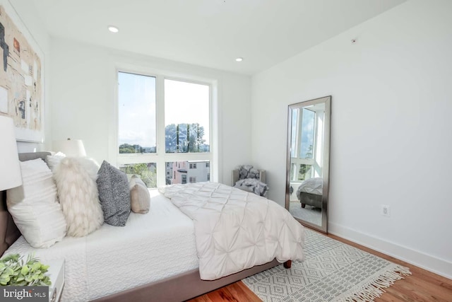 bedroom with hardwood / wood-style floors