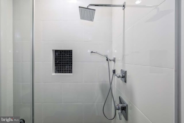 bathroom with a tile shower