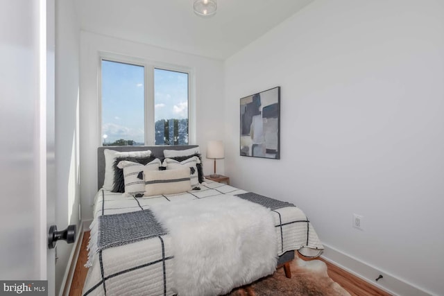 bedroom with hardwood / wood-style floors