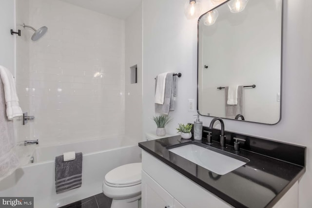 full bathroom featuring tile patterned flooring, vanity, toilet, and shower / washtub combination