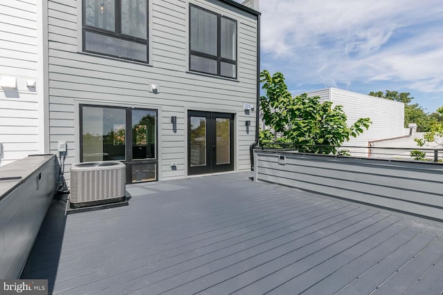 deck featuring french doors and cooling unit