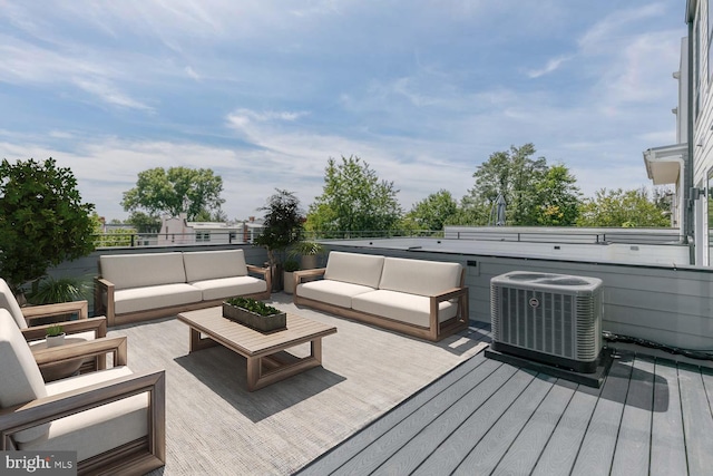 deck with central AC unit and an outdoor hangout area