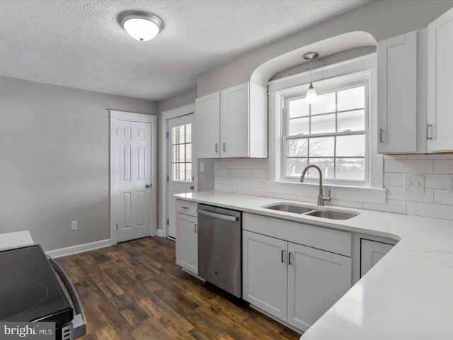 kitchen with sink, stainless steel appliances, white cabinetry, and decorative backsplash