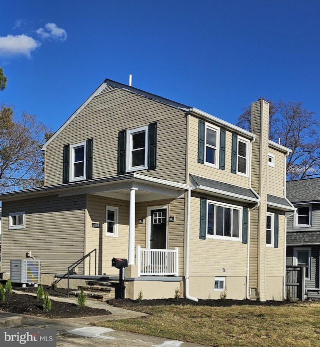 view of front of property featuring a porch and central AC