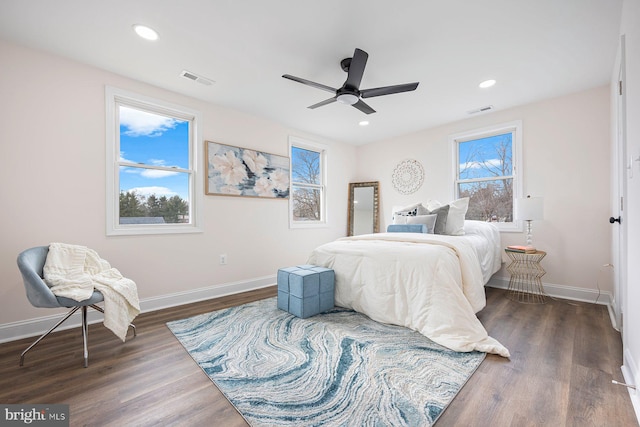 bedroom featuring ceiling fan and dark hardwood / wood-style floors