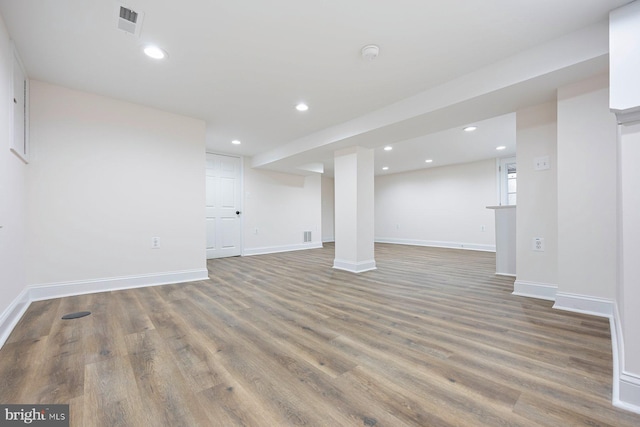 basement featuring hardwood / wood-style flooring