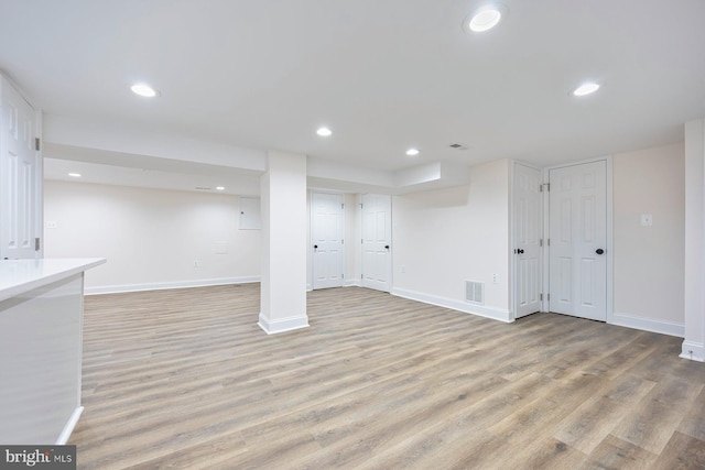 basement featuring light hardwood / wood-style floors