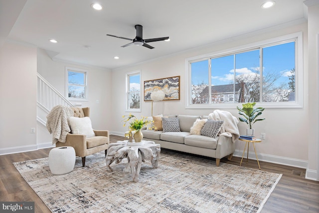 living room with ceiling fan, hardwood / wood-style floors, and ornamental molding