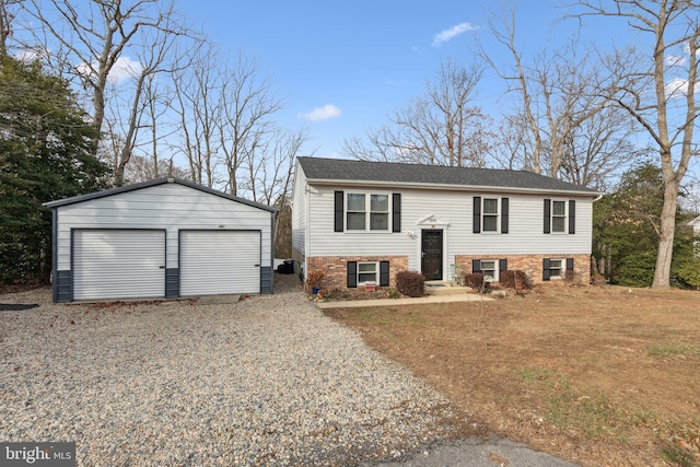 bi-level home with an outbuilding and a garage