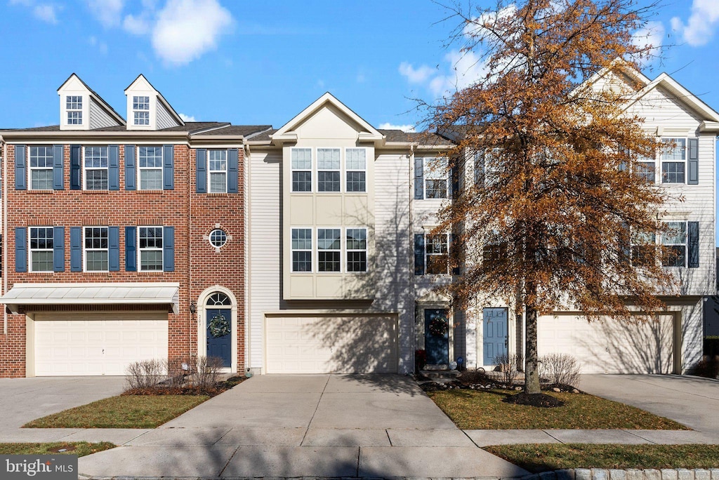 multi unit property featuring a garage