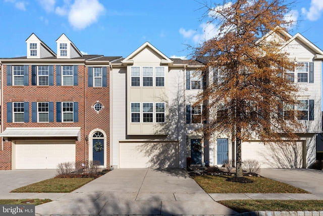 multi unit property featuring a garage