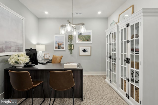 office area with light hardwood / wood-style floors