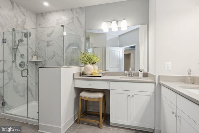 bathroom featuring tile patterned floors, vanity, and an enclosed shower