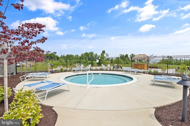 view of swimming pool featuring a patio area