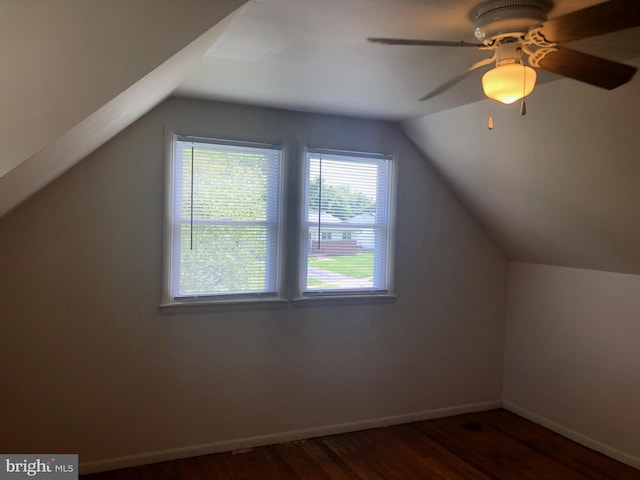 bonus room with dark hardwood / wood-style floors, vaulted ceiling, and ceiling fan