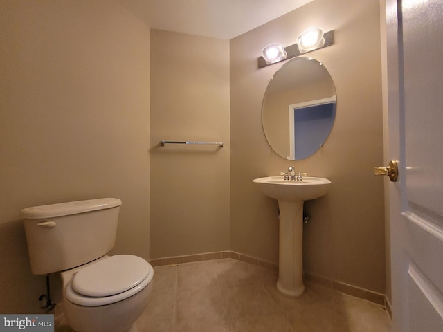 bathroom featuring tile patterned flooring and toilet